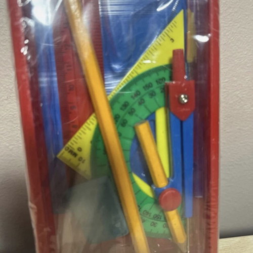 Geometric instrument set new with compass, ruler, pencil, eraser, sharpener