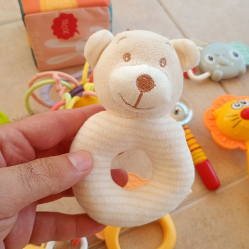 Set of 32 baby rattles including plush toys and large dice