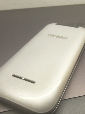 Alcatel mobile phone, silver, memory card slot