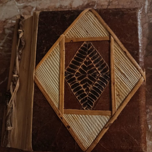 Handmade photo album with carved wooden details, vintage style