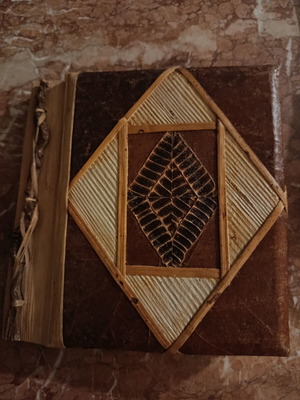 Handmade photo album with carved wooden details, vintage style