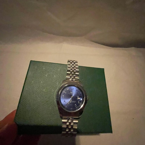 Seiko watch with blue dial and silver bracelet