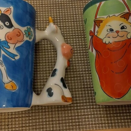 Large mugs used with cat and cow handles