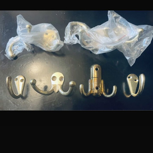 Double and single gold-coloured wall hooks