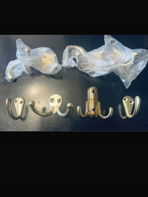 Double and single gold-coloured wall hooks