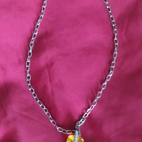 Steel pendant with yellow stone like new