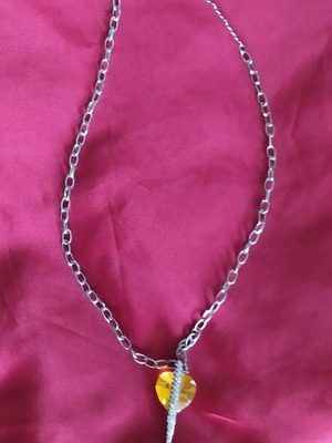 Steel pendant with yellow stone like new