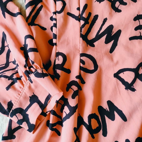 Shirt dress or tunic new, peach color with black graffiti