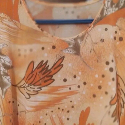 Blouse in shades of orange with beautiful design, like new, XL