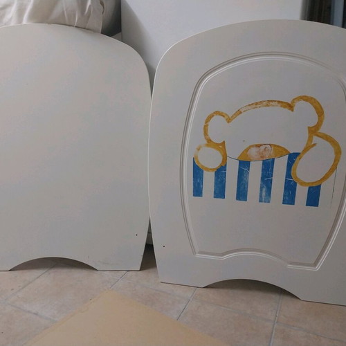 Baby cot used with accessories and fresh sheets