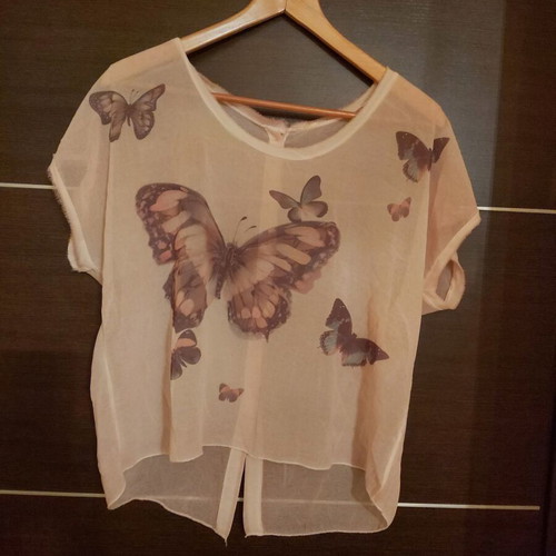 Women's blouse with print and buttons at back, like new, size M