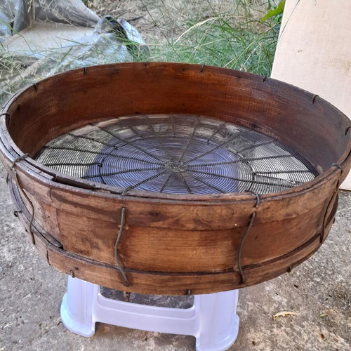 Handmade antique sieve with wooden frame and metal mesh
