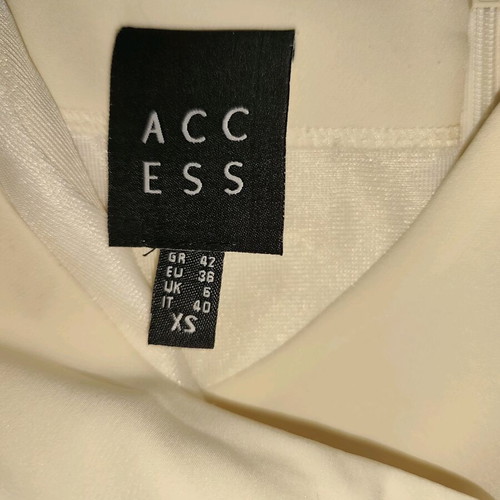 Access jumpsuit extra small white used with minor strap defect