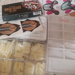 Nail art kit with tips, stamping plates and accessories