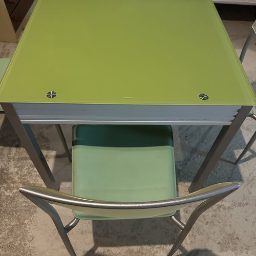 Glass dining table with extension and 4 used chairs, light green