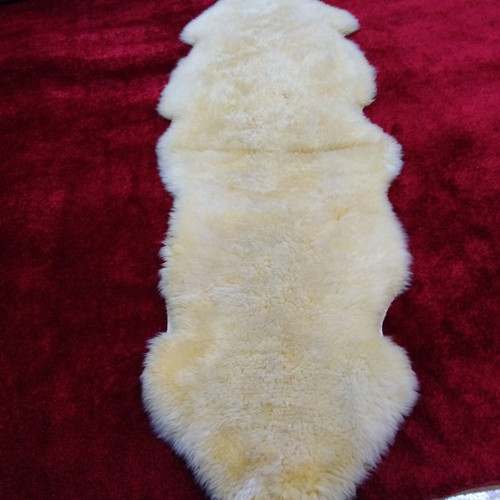 Sheepskin rug new, champagne color 2.05x0.75