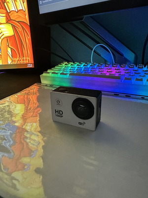 HD 1080P camera with charging cable and tripod case