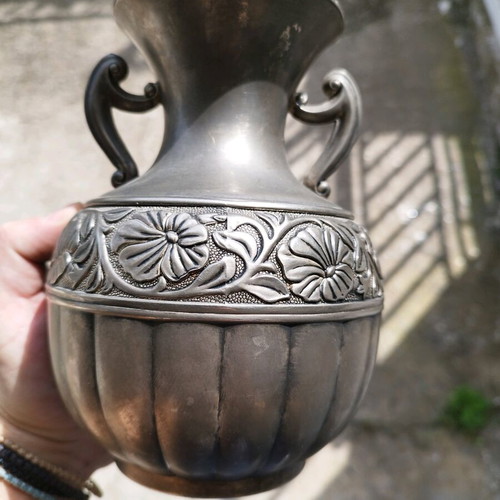 Vintage amphora used with embossed flowers and carved handles