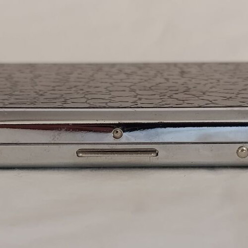 Old cigarette case with built-in lighter used, 1980s metal corporate gift