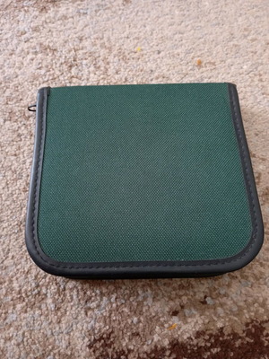 CD/DVD case used, capacity for 12 discs with 6 transparent sleeves