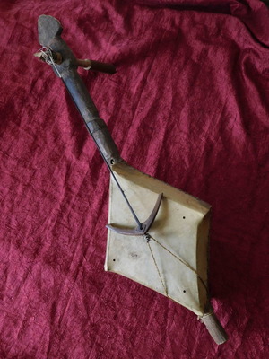 Antique musical instrument used, made of wood and leather