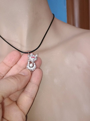 Cat pendant necklace new, silver plated with rhinestones and red eyes
