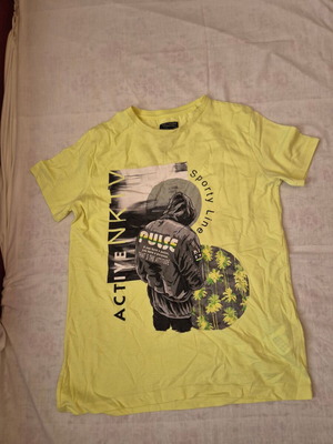 Nukutavake T-shirt designed in Spain size 14 like new, yellow