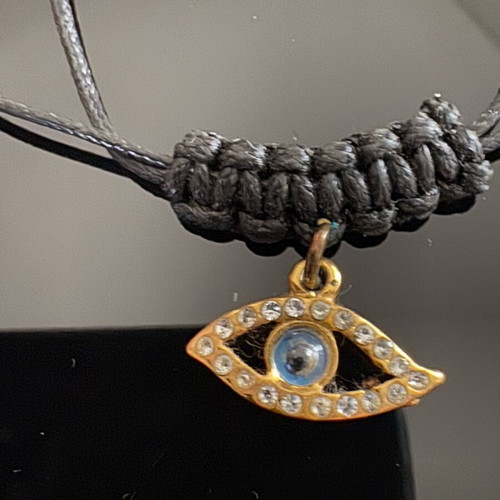 Adjustable necklace with cord and eye charm with rhinestones, new, black and gold