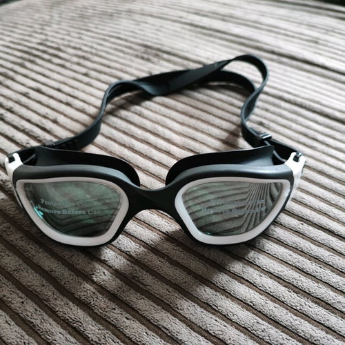White swimming goggles new