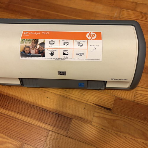 HP Deskjet D1560 printer used, ideal for small spaces with cables and ink