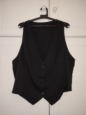 Women's black suit vest used