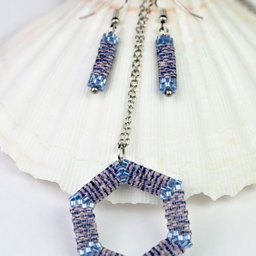 Custom-made jewelry set in light blue tones with hexagonal pendant