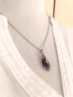 Amethyst wire-wrapped pendant on steel chain
