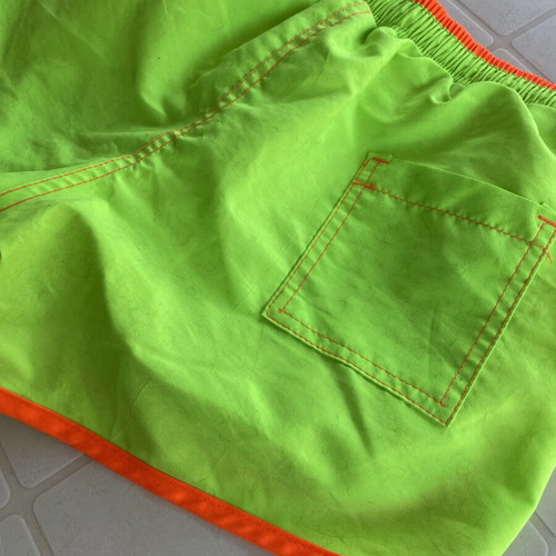 Men's swim shorts like new, fluorescent green with orange details