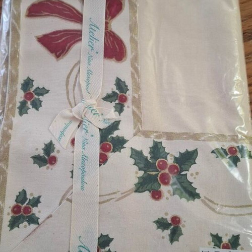 Christmas tablecloth new with holly design and red bow