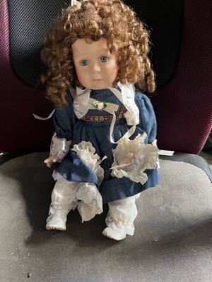 Porcelain doll used, missing soles, needs glue