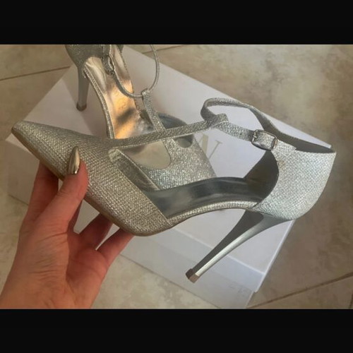 Silver pumps like new with ankle strap and thin heel, size 37