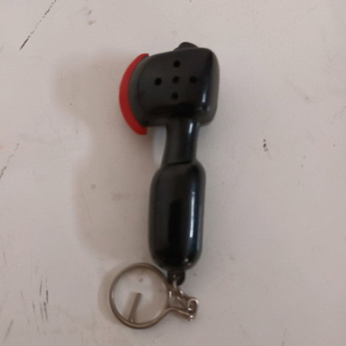 Axe keychain like new, makes sound when hit, black