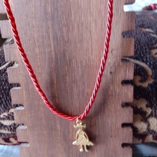 Handmade short necklace with twisted red cord and gold girl pendant