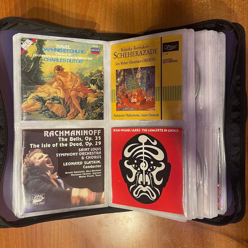 Collection of 64 CDs with carrying case, classical jazz entechno