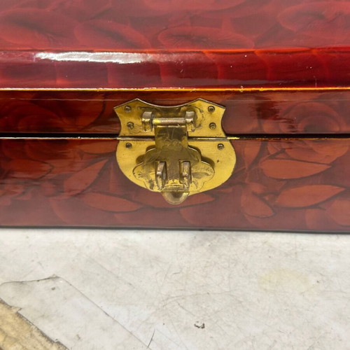 Vintage wooden jewelry box used with red satin lining