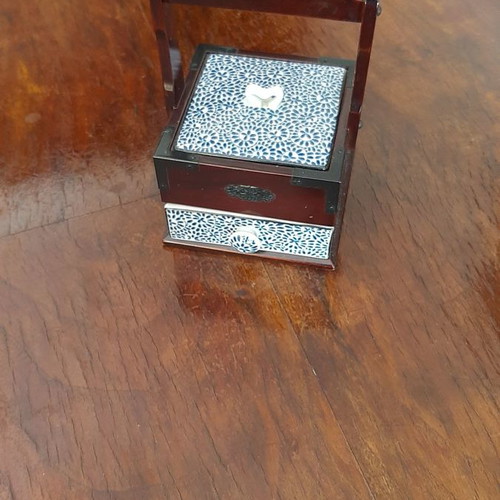 Decorative box used with cherry wood and porcelain