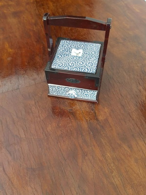 Decorative box used with cherry wood and porcelain