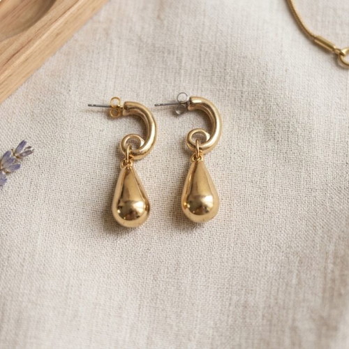 Teardrop gold earrings used with spiral hook design