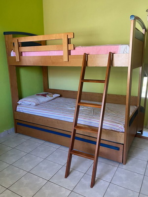 Wooden bunk bed with third sliding bed and mattresses like new