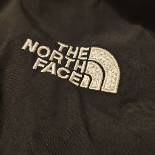 The North Face waterproof windbreaker jacket used, size large, black