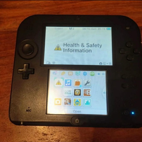 Nintendo 2DS used with stylus and charger