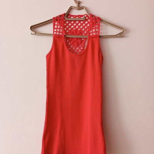 Red sleeveless blouse like new with white shorts and striped belt
