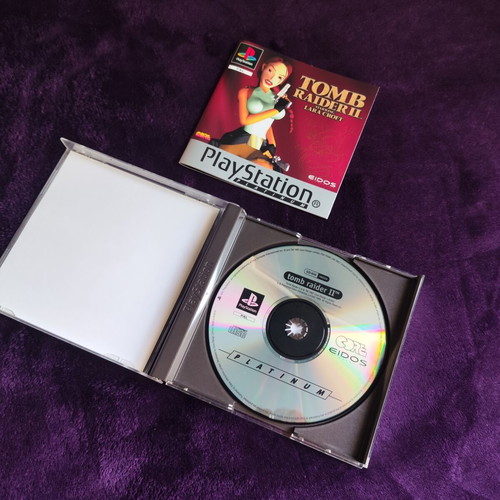 Tomb Raider II PS1 Platinum Edition game used, case with cracks