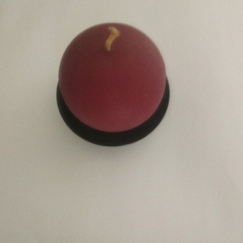 Round candle on metal black base like new